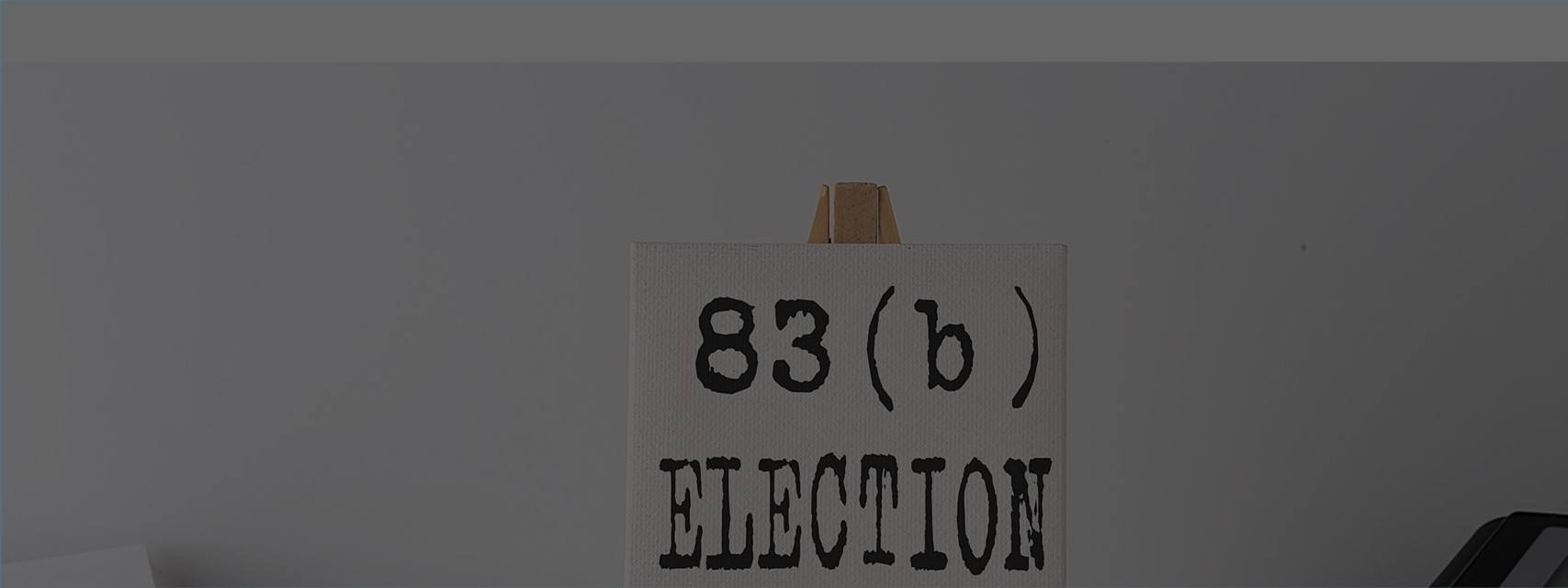 Easel with painting for words "83(b) election," with a calculator and a spreadsheet