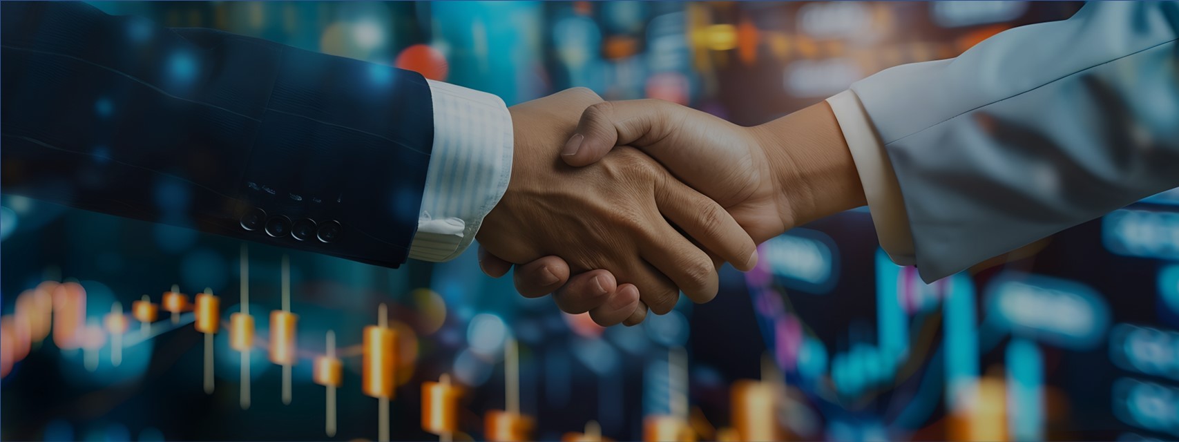 Two business people shaking hands in front of chart of stock prices