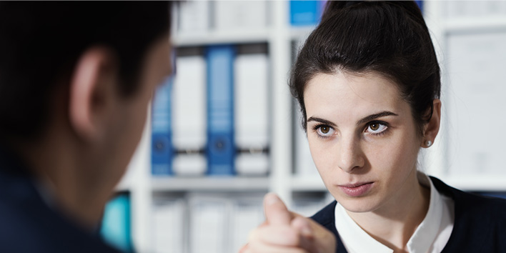 Woman arm wrestling with intense look on her face, probably trying to get budget to for mobility tracking